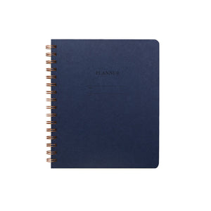 Image of dark blue cover with letter pressed text says, “Planner”. “Name” and “Date” with lines for writing. Coiled binding on left side.