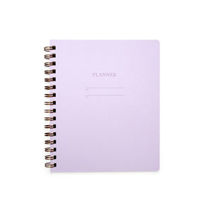 Image of lilac cover with letter pressed text says, “Planner”. “Name” and “Date” with lines for writing. Coiled binding on left side.