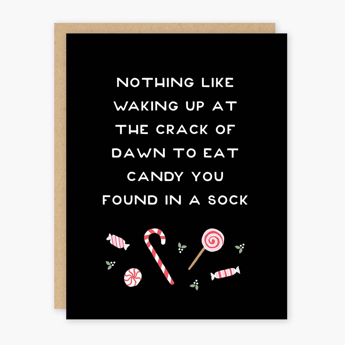 Black card with white text saying, “Nothing Like Waking Up At the Crack of Dawn to Eat Candy You Found In A Sock”. Images of candy canes, peppermint candies and holly berries. A brown envelope is included.