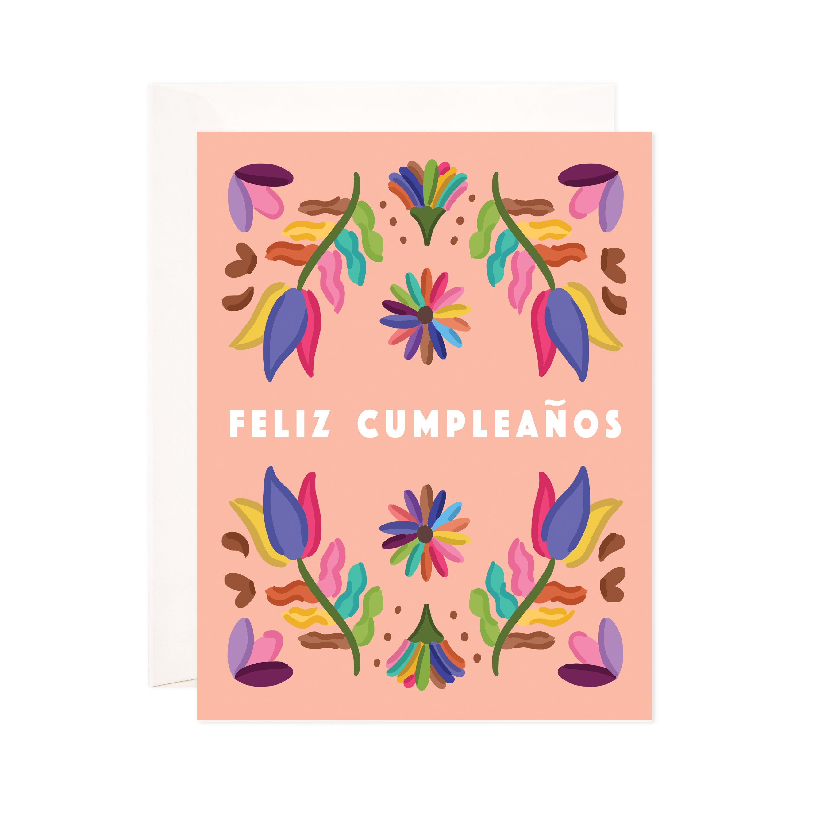 Pink card with white text saying, "Feliz Cumpleanos". Images of mulitcolored floral patterns. An ivory envelope is included.