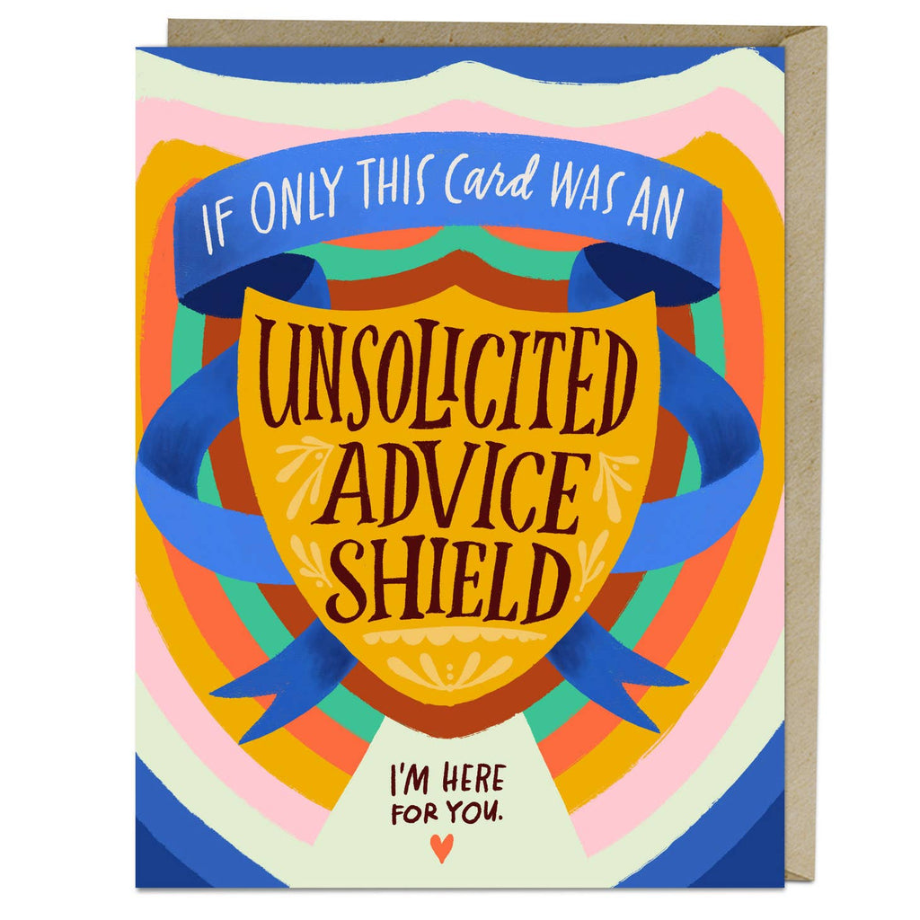 Blue card with white and brown text saying, “If Only This Card Was An Unsolicited Advice Shield. I’m Here For You”. Image of a gold shield with a blue ribbon around it and pink heart at the bottom. A gray envelope is included.