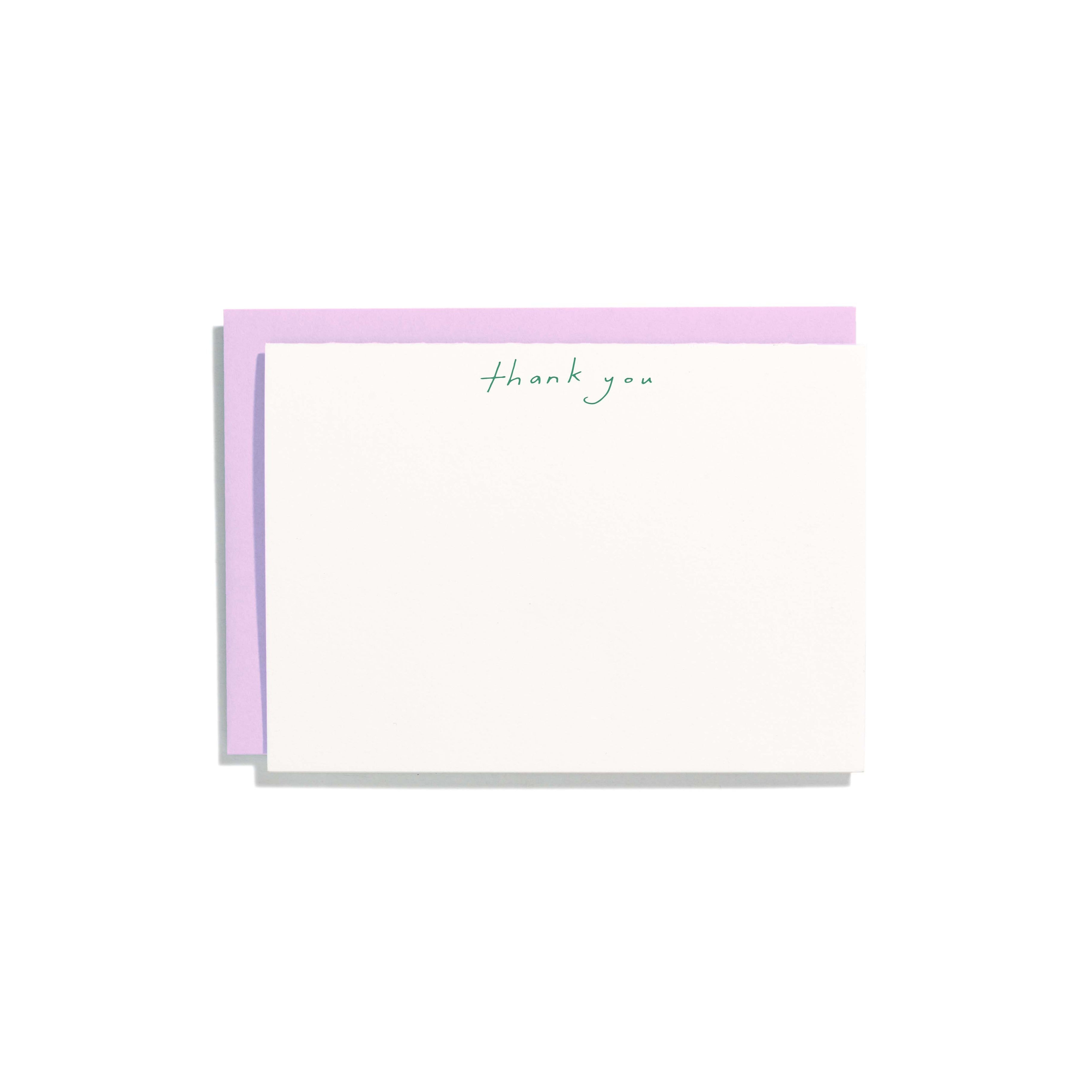 Ivory background with green text at top of card says, “Thank you”. Lavender envelopes included. 