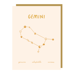 Ivory card with gold text saying, "Gemini Genuine Adaptable Curious". Image of the Gemini Zodiac symbol. A gold envelope is included.