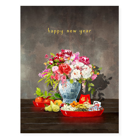 Brown card with yellow text saying, "Happy New Year". Images of a vase of flowers along with a tray of Lunar New Year items. An envelope is included.
