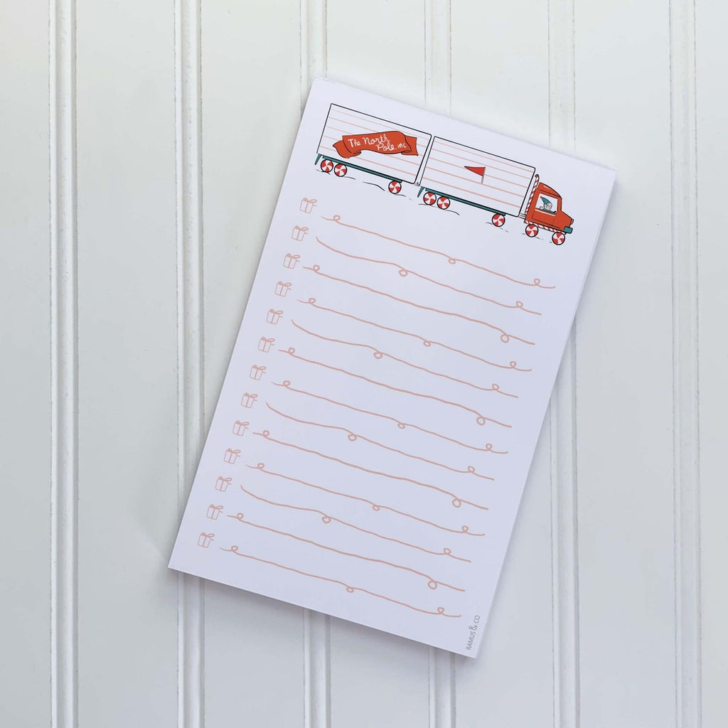 Image of notepad with white background and image of double trailer truck in red, white, and blue with a red banner with white text says, “The North Pole Inc.” and red lines for writing with small gift boxes as checkboxes. 