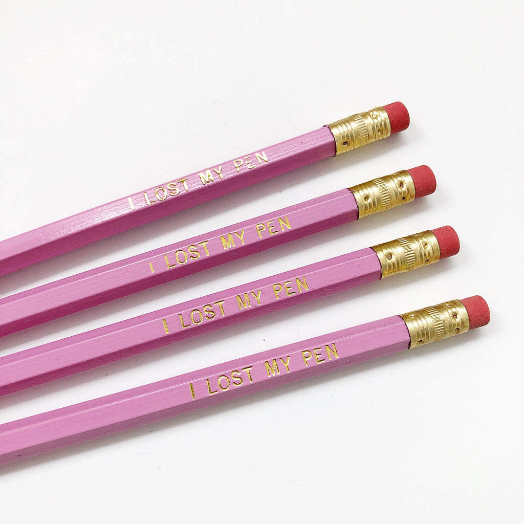 Image of pink pencil with gold foil text says, "I lost my pen". 