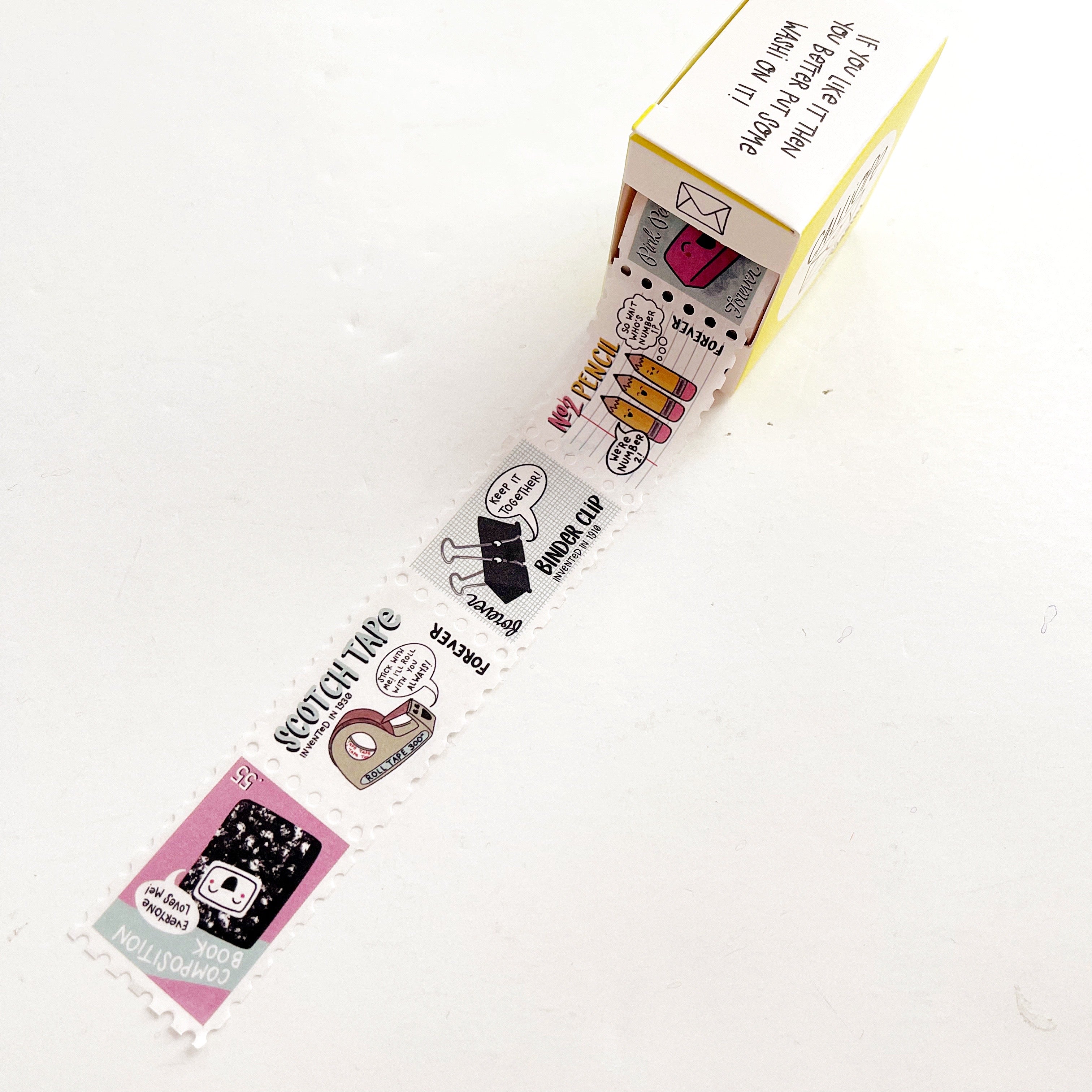 Image of washi tape with white, pink and grey background with stamps with office supplies on each stamp. 