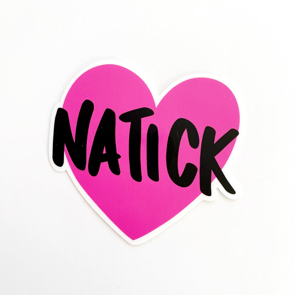 Image of bright pink heart with black text says, "Natick". 