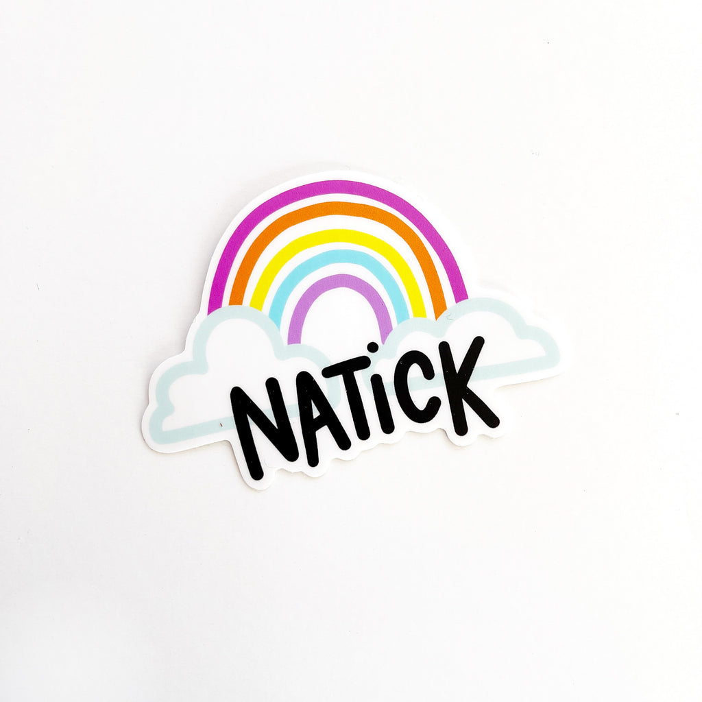 Image of sticker with bright colored rainbow with clouds at each end and black text says, "Natick". 
