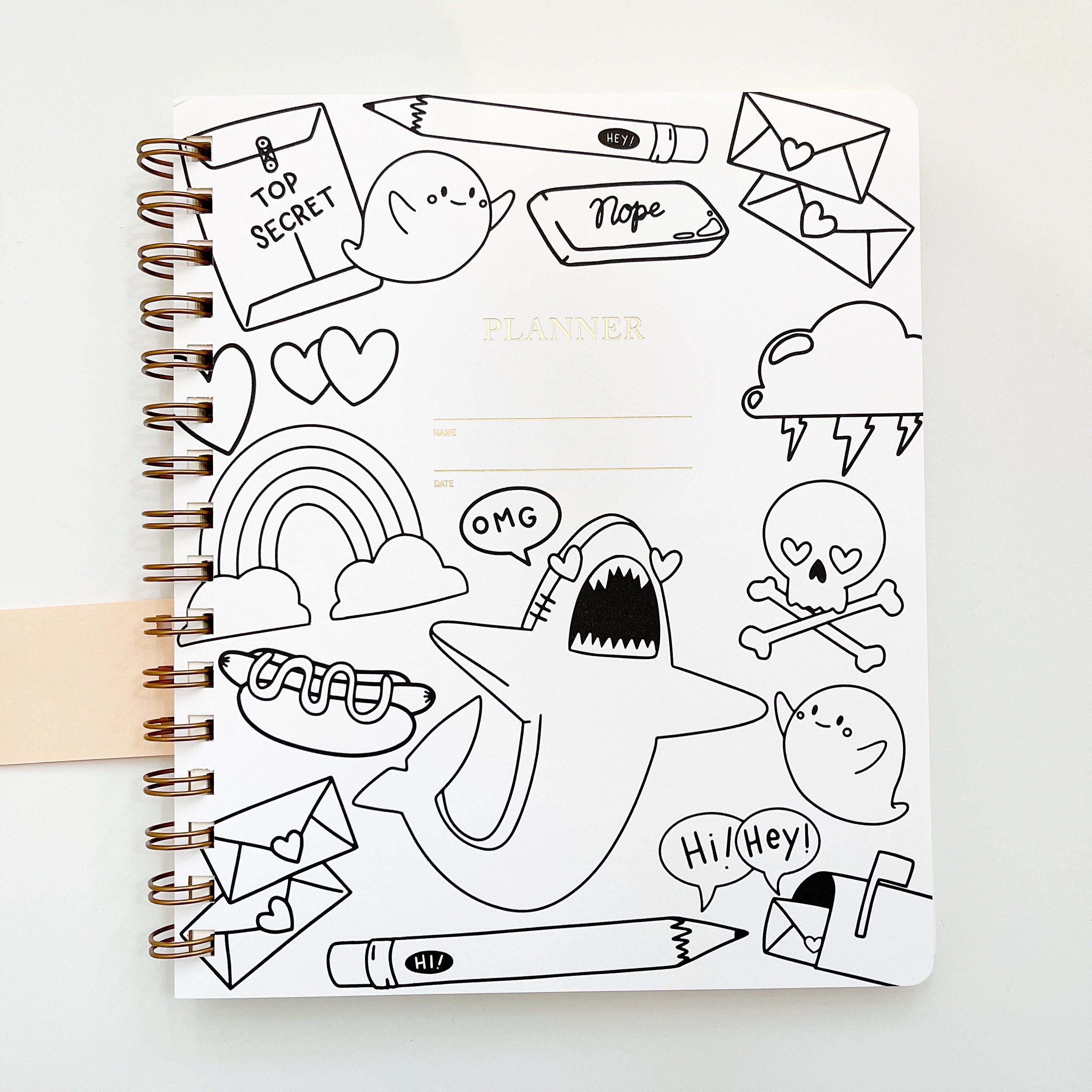 Image of notebook cover with white background and black outlines of shark, cloud, letters, pencil, skull, mailbox, eraser and hot dog.