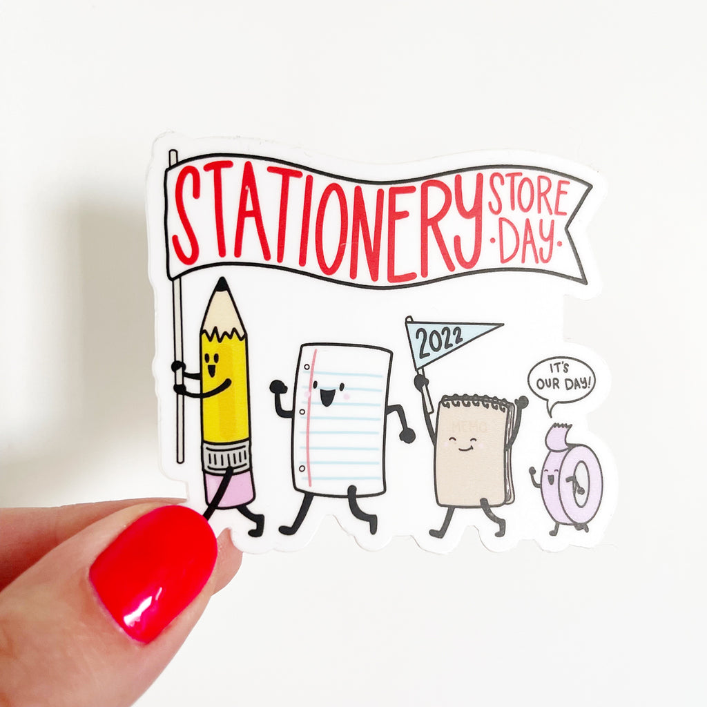 Image of sticker with white background and image of stationery store day characters on parade. 