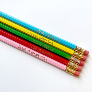 Images of five pencils with gold foil text say, "100% That Bitch, It's About Damn Time, You're Special, I Love You Bitch, Blame It On My Juice".