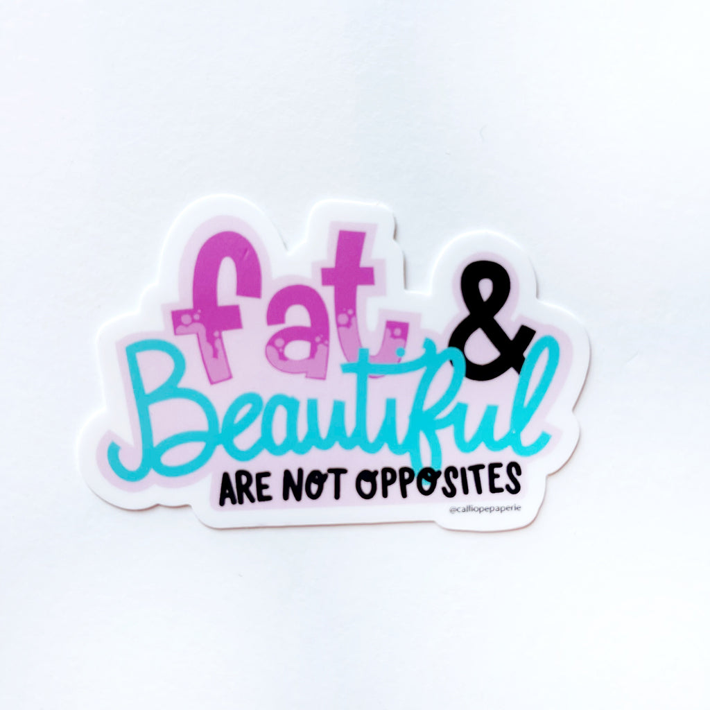 Fat & beautiful are not opposites. "Fat" is a dark pink letteringwith light pink highlights, black ampersand, "beautiful" is a teal script and "are not opposites" is a black uppercase lettering.