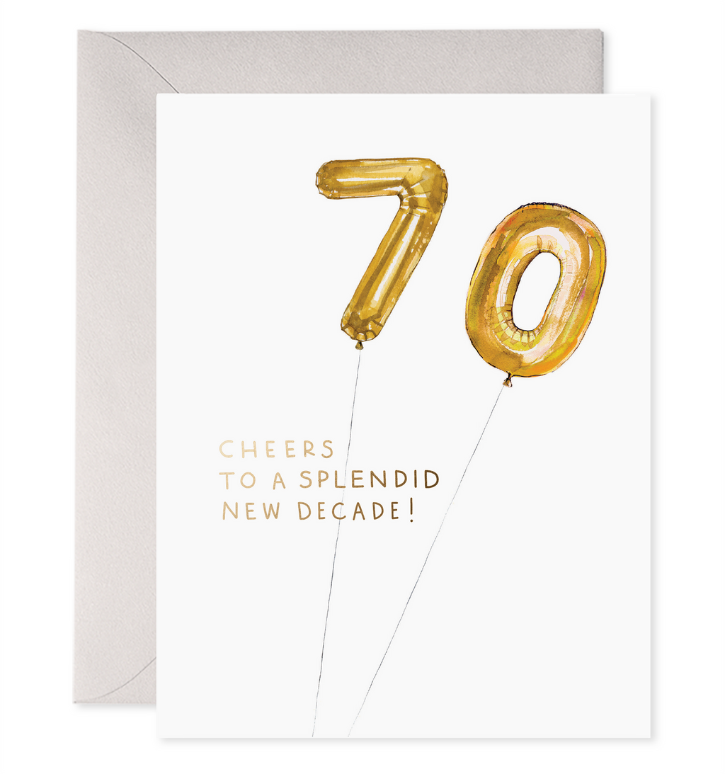 White card with black text saying, “Cheers to a Splendid New Decade”. Images of gold foil balloons in the shape of a seven and a zero. A grey envelope is included.