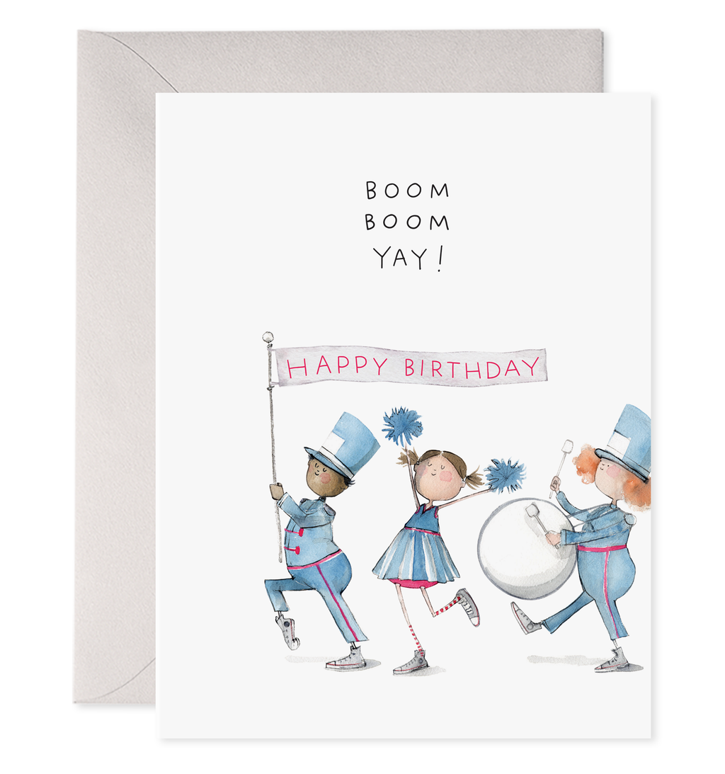 White card with black text saying, “Boom Boom Yay! Happy Birthday”. Image of a marching band holding a birthday flag. A purple envelope is included.