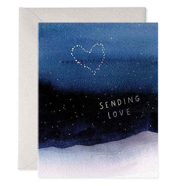 Blue card with white text saying, “Sending Love”. Image of a nighttime sky with star constellation forming a heart. A purple envelope is included.