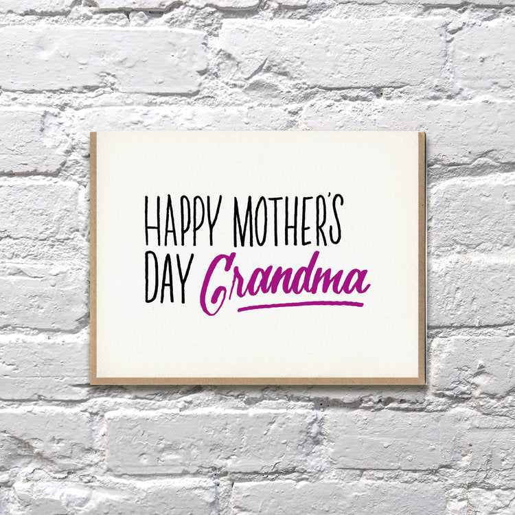 White card with black and purple text saying, “Happy Mother’s Day Grandma”. A gray envelope is included.
