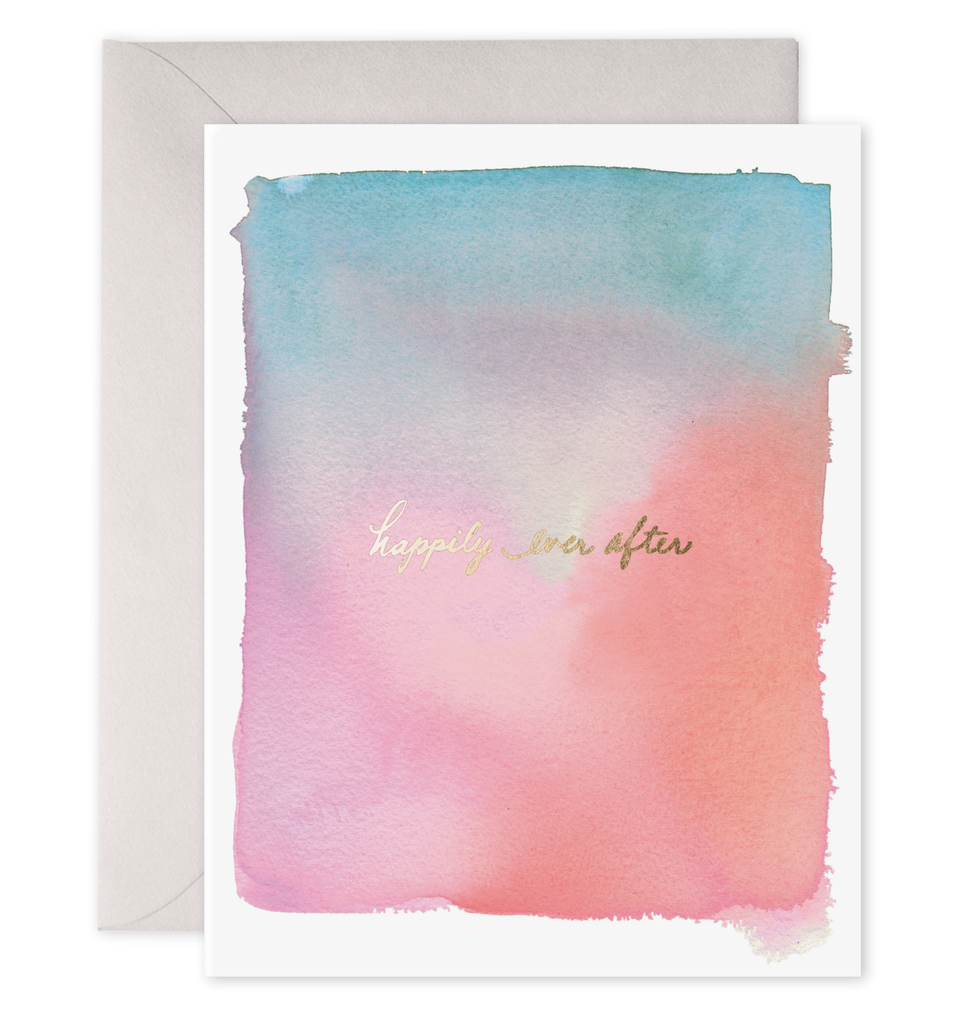 White card with gold text saying, “Happily Ever After”. Image of purple and pink water color design. A grey envelope is included.