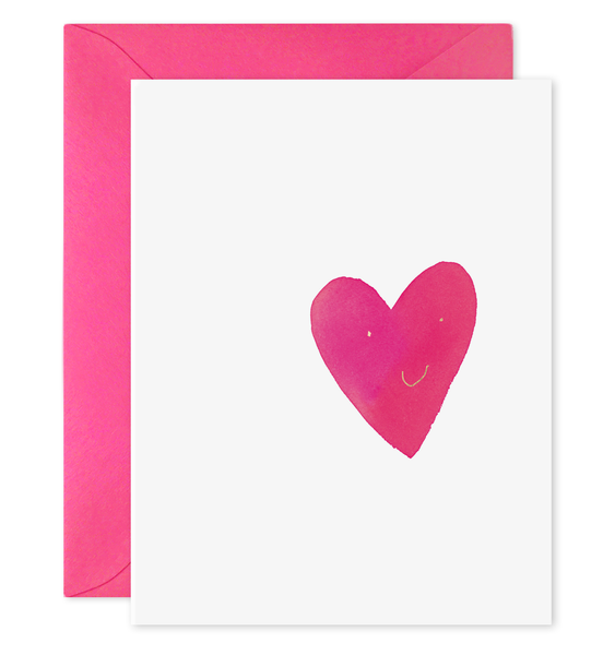 White card with image of a pink heart with a smiling face on it. A pink envelope is included.