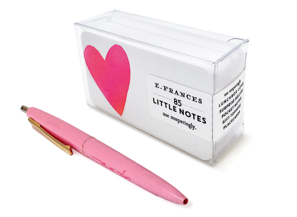 Image of packaged of little notes. Little note image with white background and image of red heart on left side of card. An image of a pink pen is placed next to the box of notes to show the scale of the items for reference. 