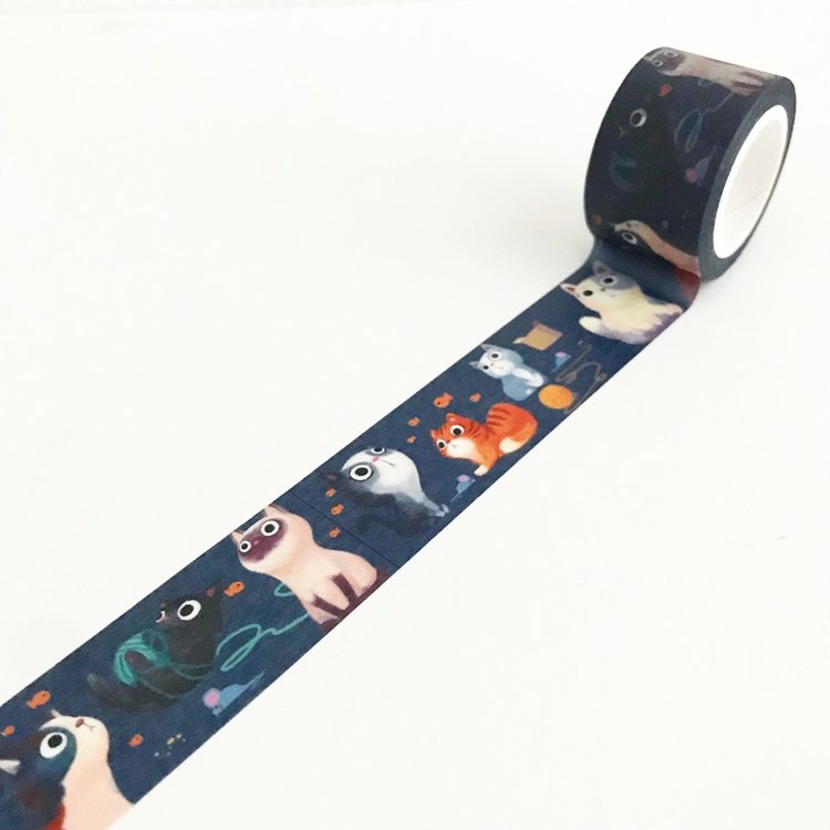 Navy tape with images of playful kittens with blue yarn and gold stars in a repeating pattern.
