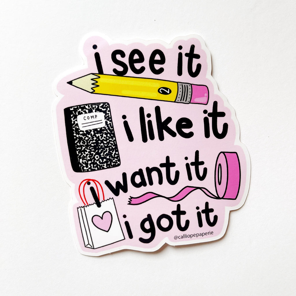Die-cut sticker with a pencil, notebook, roll of pink tape and a small shopping bag with a pink heart on it. Text says "I see it" (Above the pencil) "I like it" to the right of the notebook, "I want it" to the left of the tape "I got it" to the right of the shopping bag.