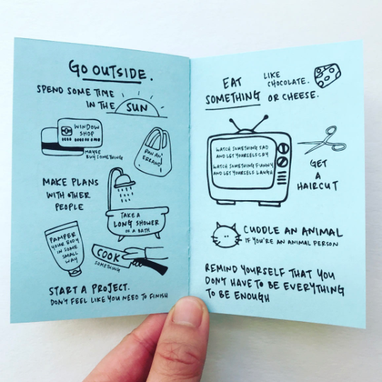 Image of two pages of zine with blue background and black text says “Go outside”, “spend time in the sun”, “eat something like chocolate or cheese”, and “Get a haircut”.  
