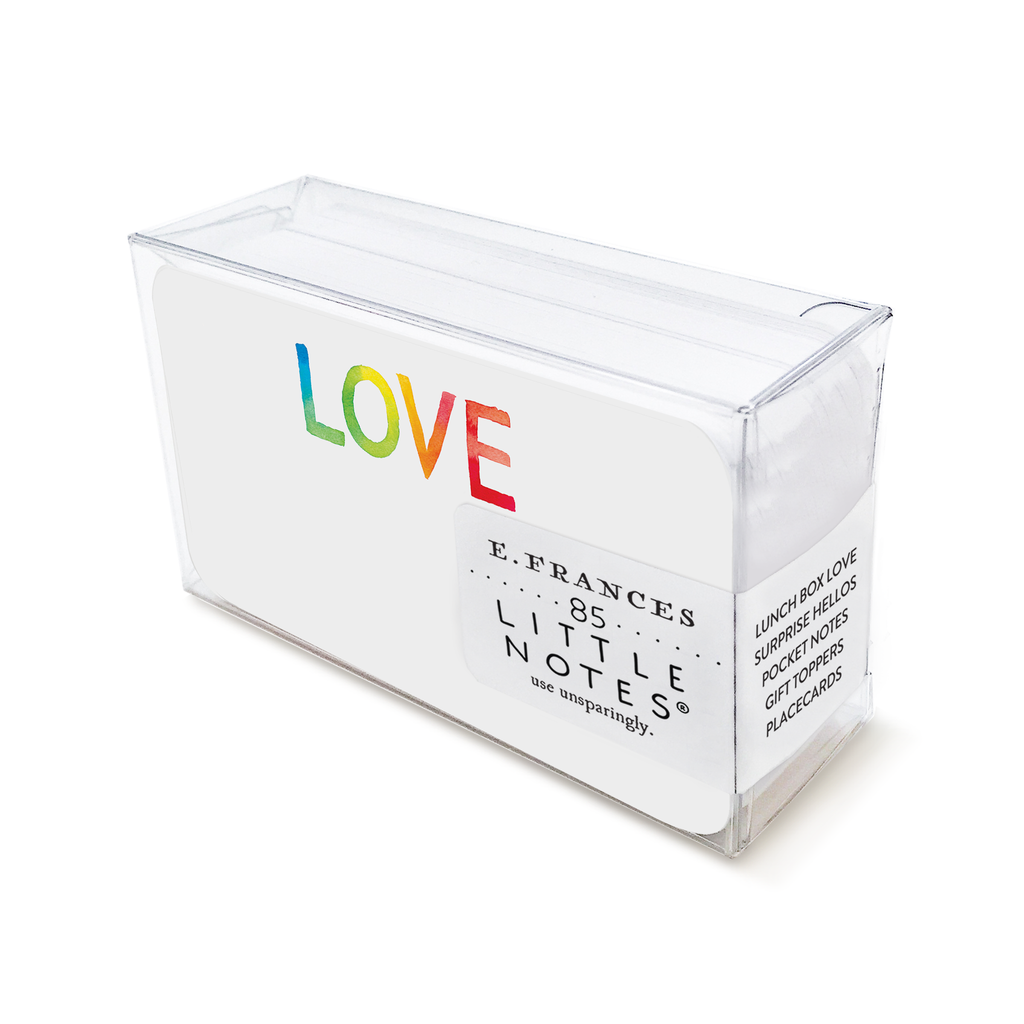 Image of box of little notes. Notecard has an image of the word LOVE in rainbow tie-dye coloring. 