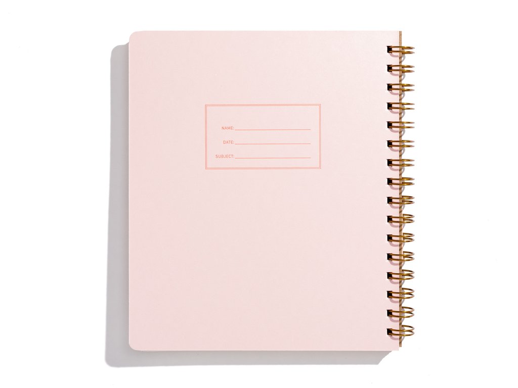 Image pink cover with letter pressed text says, “Name” and “Date” with lines for writing. Coiled binding on right side.