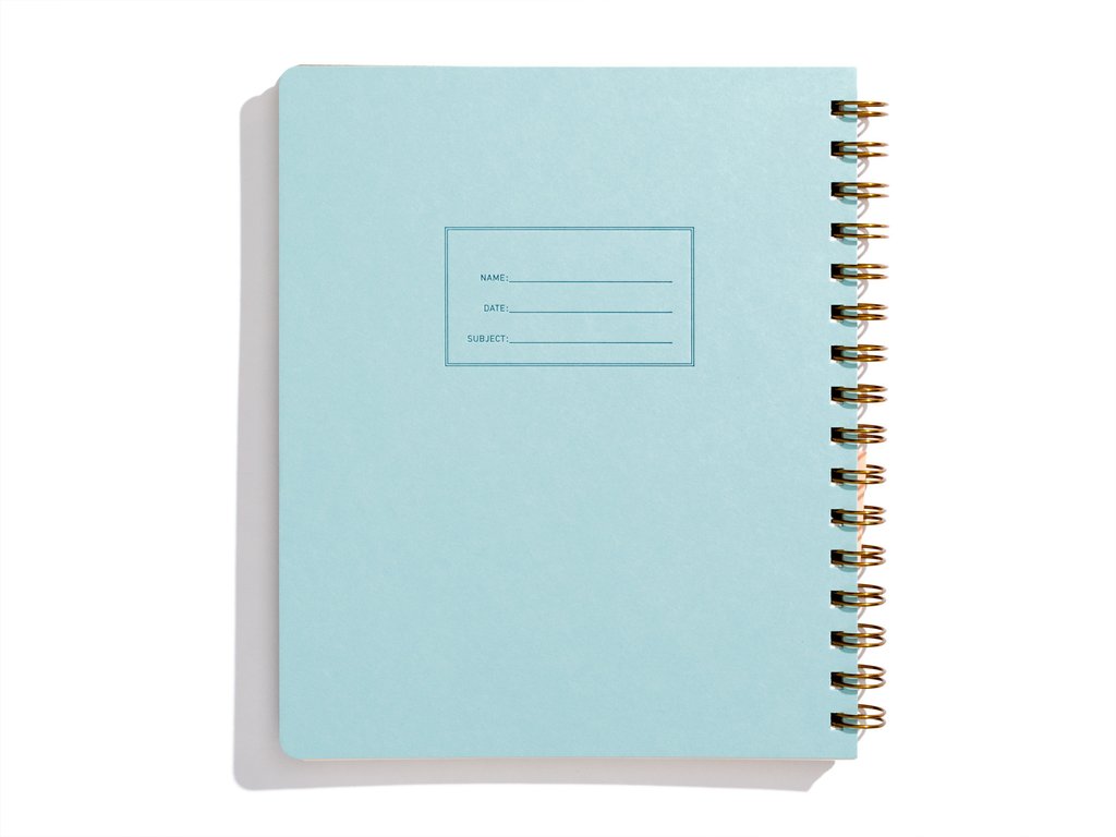 Image blue cover with letter pressed text says, “Name” and “Date” with lines for writing. Coiled binding on right side.