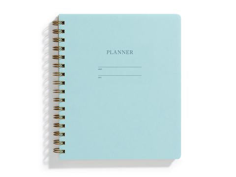 Image of pool cover with letter pressed text says, “Planner”. “Name” and “Date” with lines for writing. Coiled binding on left side.