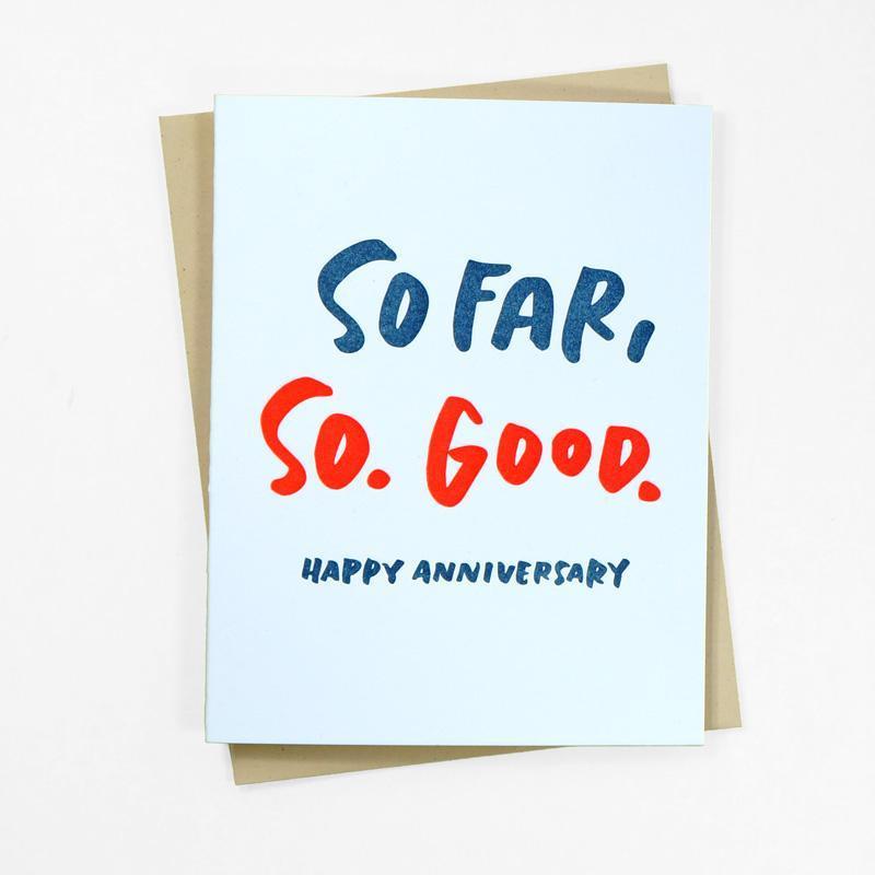 Light blue card with blue and red text saying, "So Far, So. Good. Happy Anniversary". A tan envelope is included.