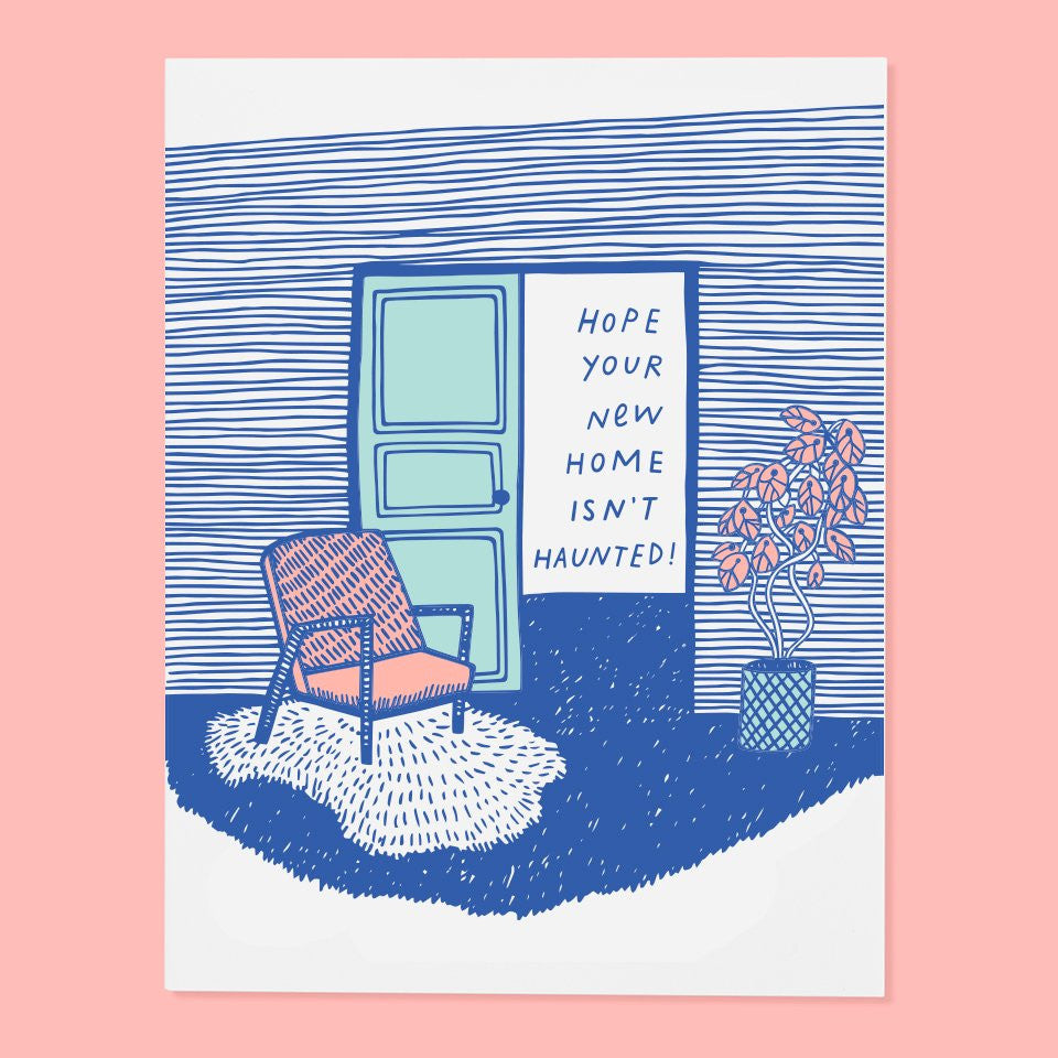 White card with blue text saying, “Hope Your New Home Isn’t Haunted!” Image of a livingroom with chair, houseplant and door. An envelope is included.