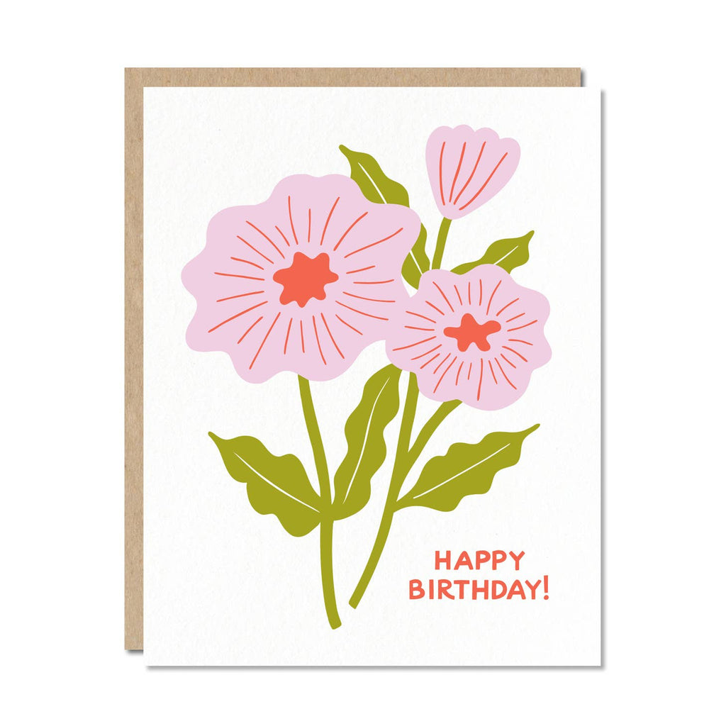 White card with orange text saying, "Happy Birthday!"  Images of pink flowers with green stems. A brown envelope is included.