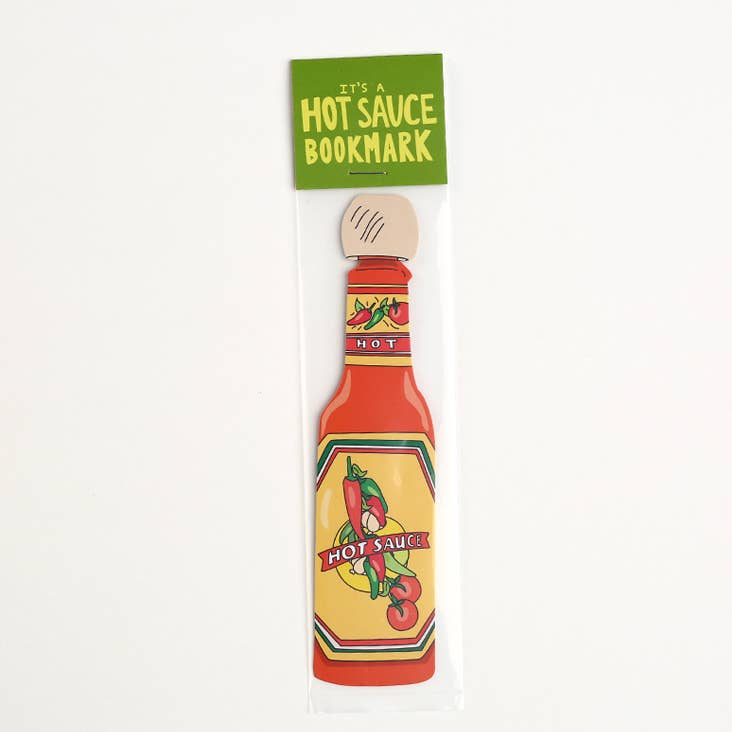 Image of a bottle of hot sauce in red and yellow with tan wooden cap. 