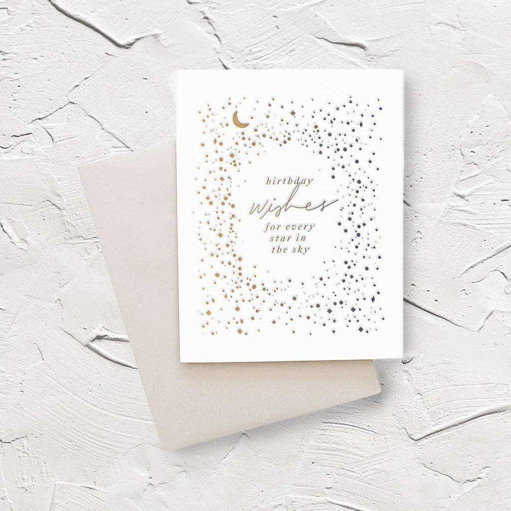 Ivory background with silver and gold stars and gold crescent moon with silver text says, “Birthday wishes for every star in the sky”. An envelope is included.  