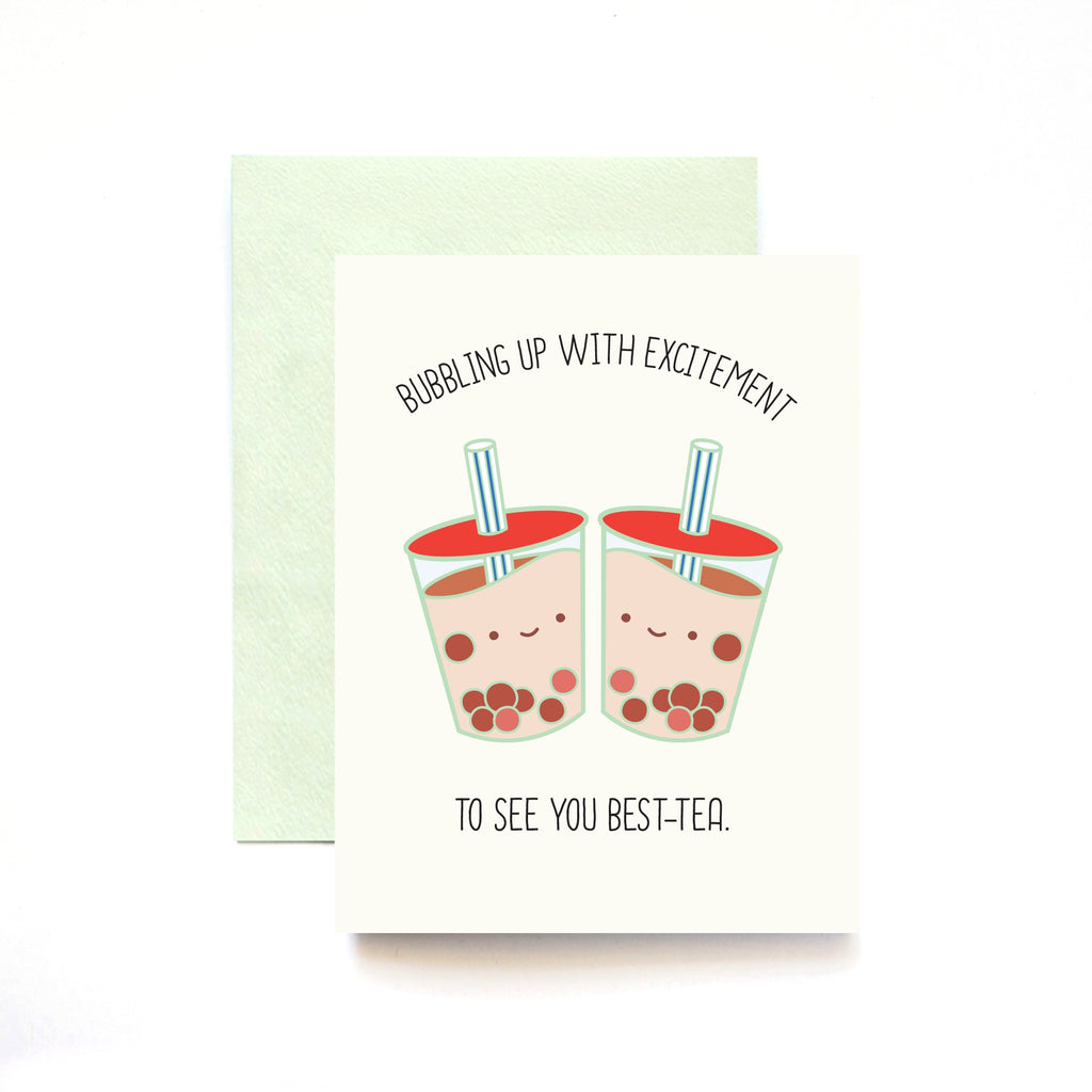 White card with black text saying, “Bubbling Up With Excitement To See You Best-Tea”. Images of two boba tea drinks with smiley faces. A green envelope is included.