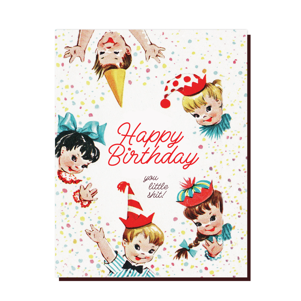 White card with red and black text saying, "Happy Birthday You Little Shit!"  Images of vintage children wearing party hats with colored confectti dots across card. An envelope is included.