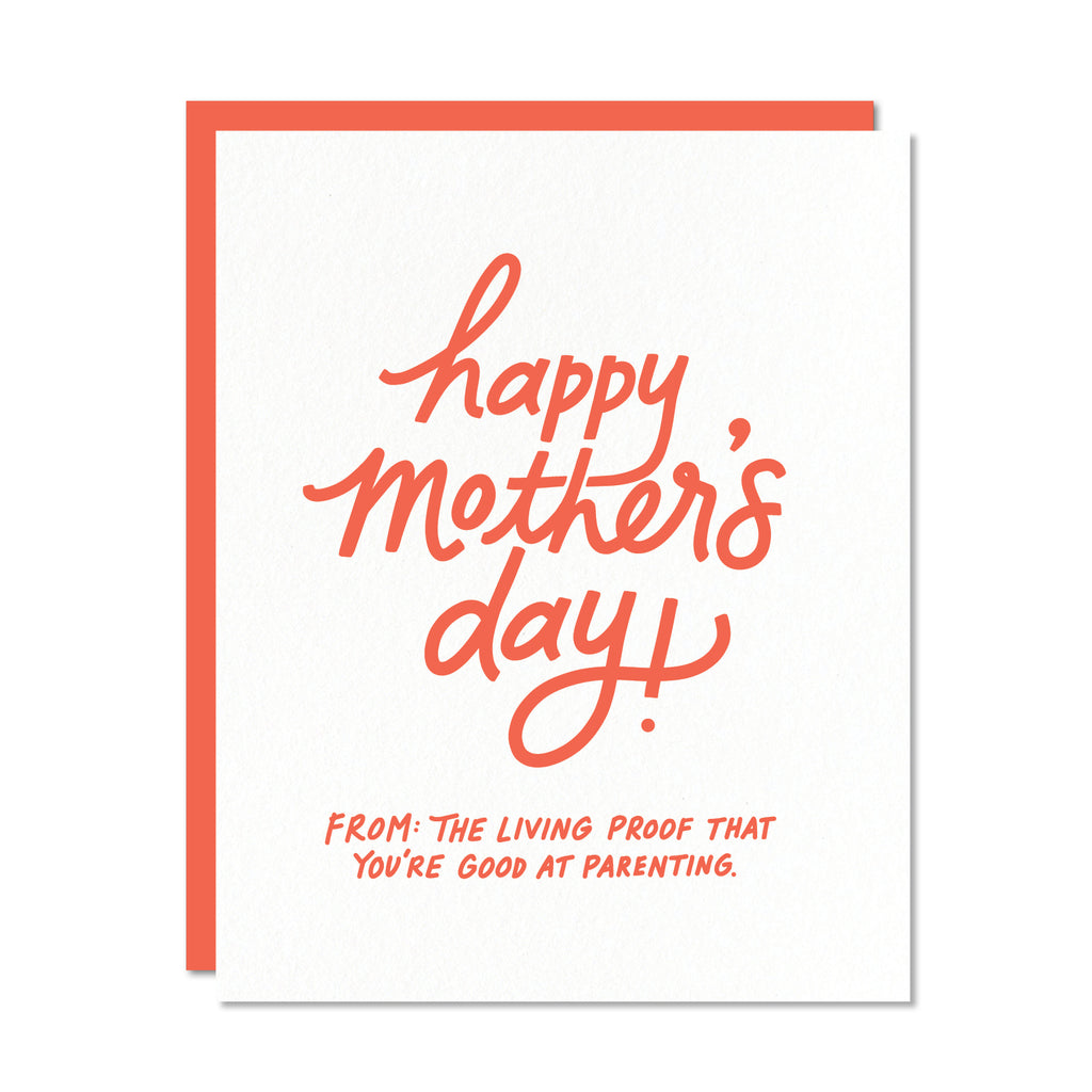 White card with red text saying, "Happy Mother's Day! From: The Living Proof That You're Good at Parenting".  A red envelope is included.
