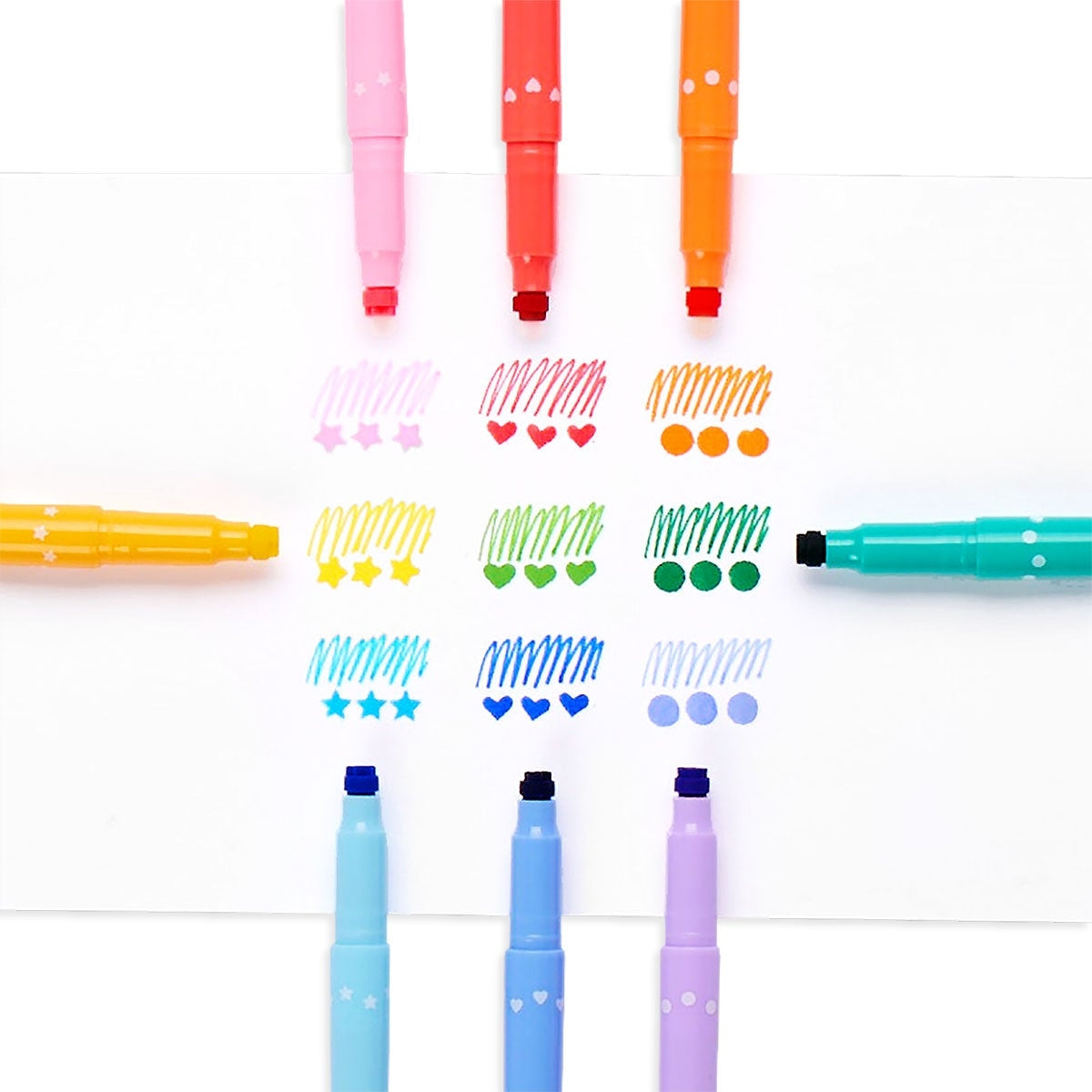 Image of box of double ended markers in a rainbow of 9 colors. Stamp ends – pink stars, red hearts, orange circles, yellow stars, green hearts, green dots, blue stars, blue hearts, purple dots. 