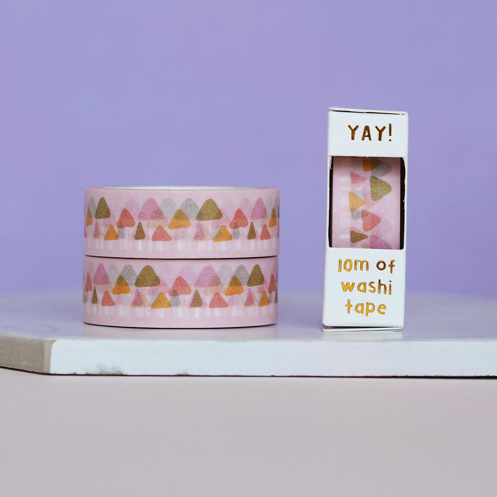 Decorative tape with light pink background with images of brown, pink, red and orange toadstools.