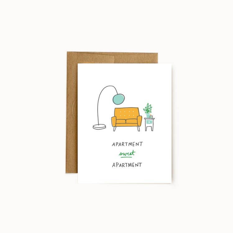 White background with image of a yellow sofa, a aqua floor lamp, a side table with a green plant. Black text says, “Apartment sweet apartment”. A kraft envelope is included.     