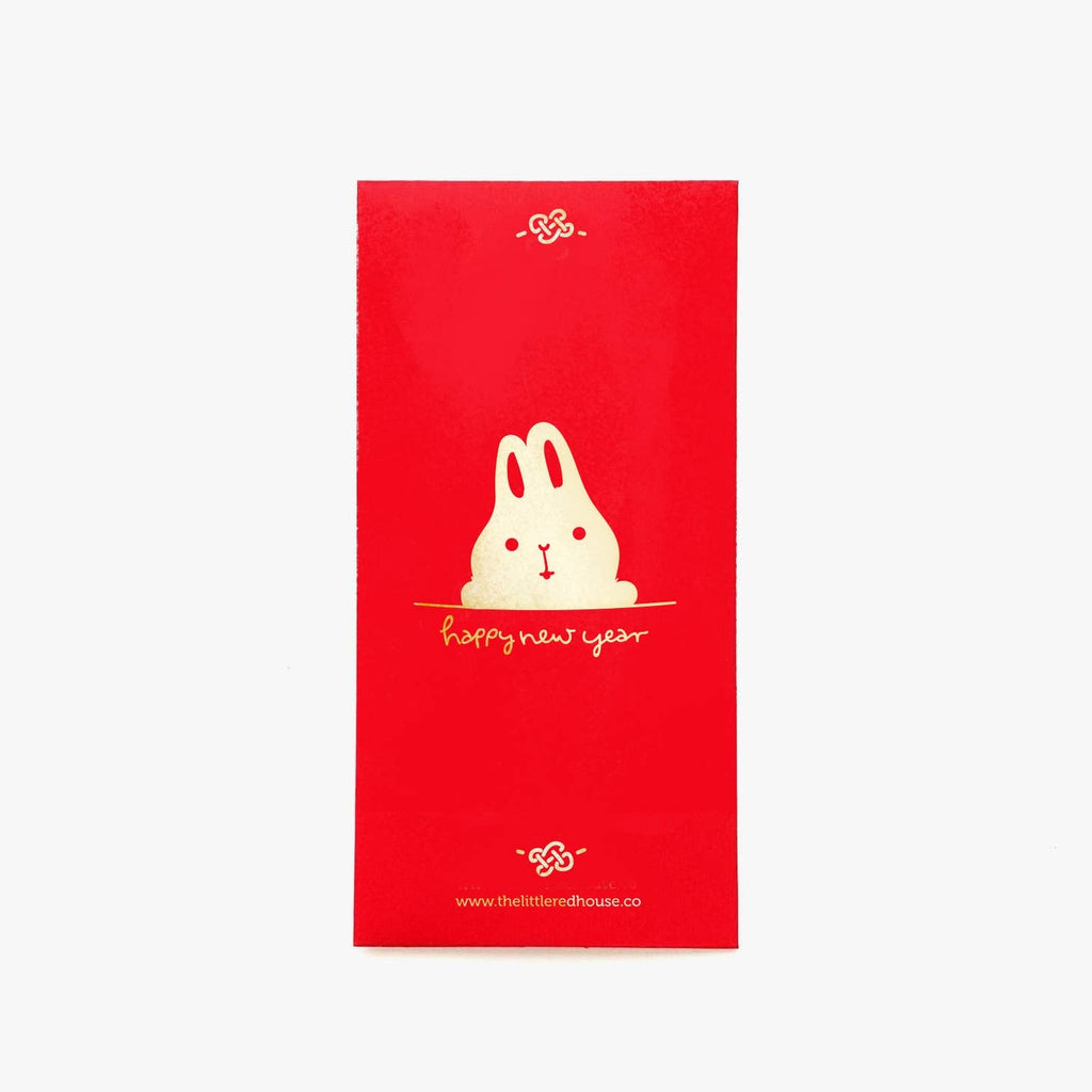 Image of red envelope with image of gold foil rabbit with gold text says, "Happy new year". 