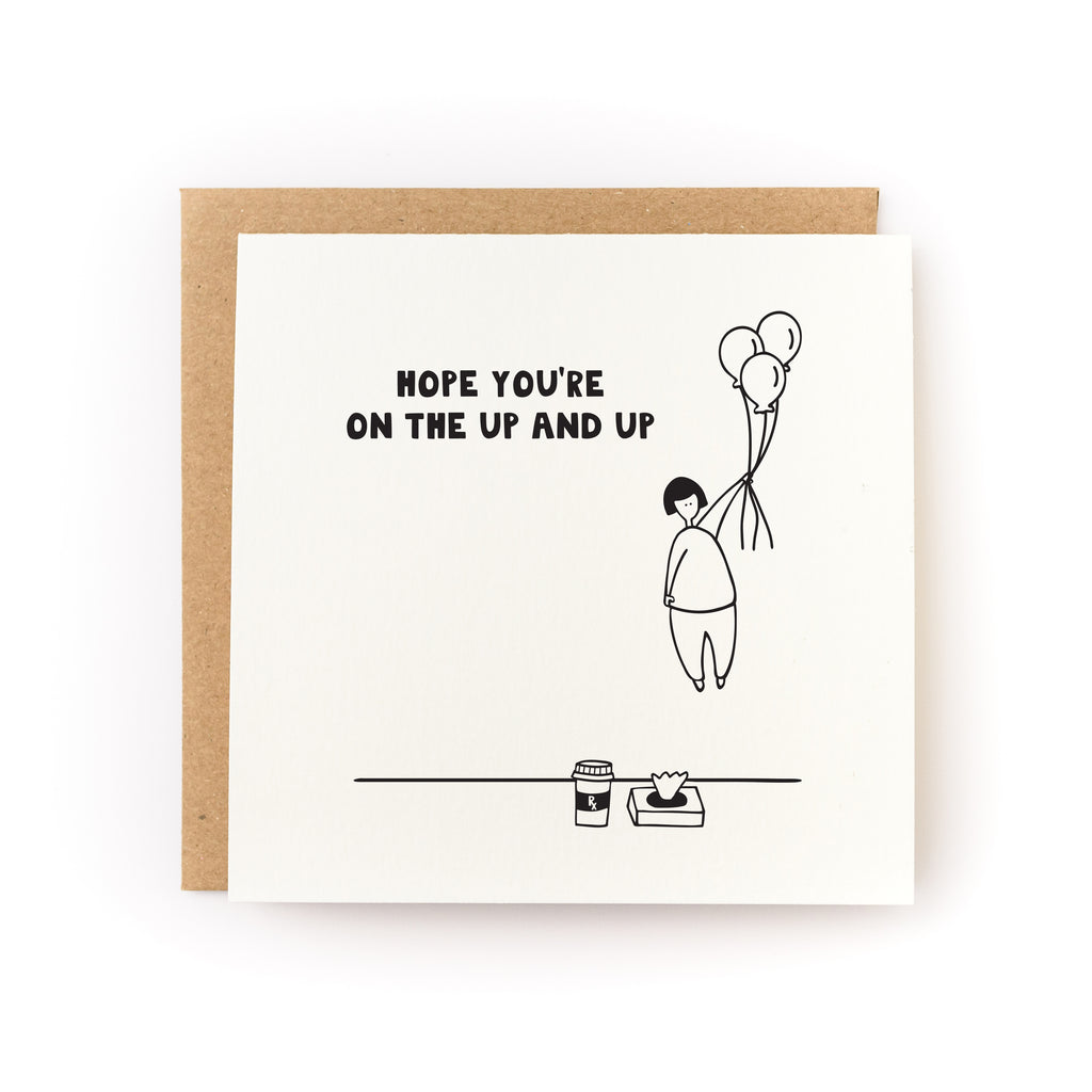 Square white card with black text saying, "Hope You're On the Up and Up". Images of a person holding a bouquet of balloons and floating into the air. Hot coffee cup and box of tissues. A brown envelope is included.