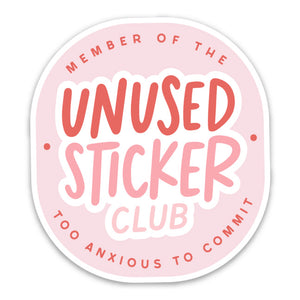 Oval sticker with light pink background with dark pink text says “Member of the too anxious to commit” around the edge. Middle of sticker says “Unused Sticker Club”. 