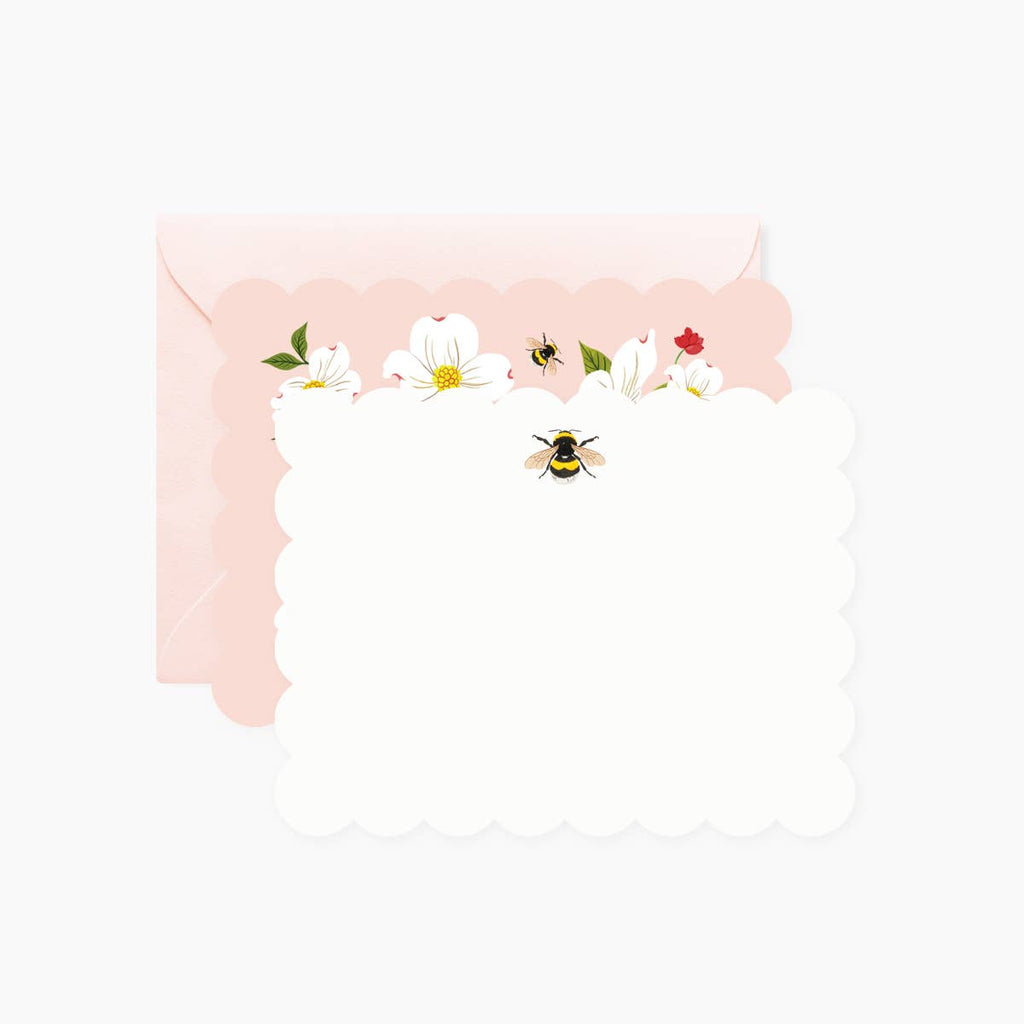 White card with scalloped edge with image of a black and yellow bee. Opposite side of card has pink background with white dogwood flowers. Pink envelopes included.