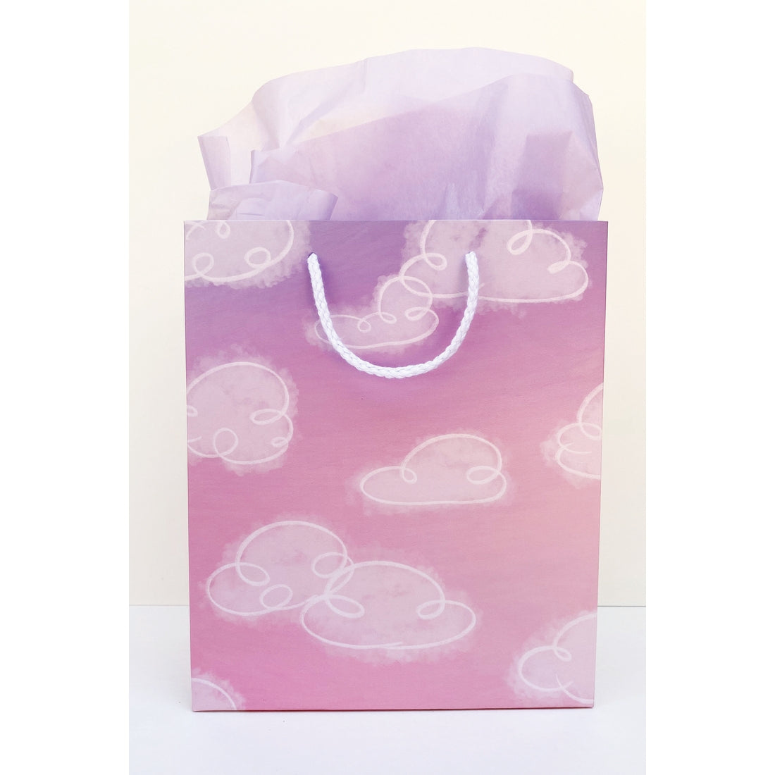 Pink and purple background with images of white clouds with white rope handle. 