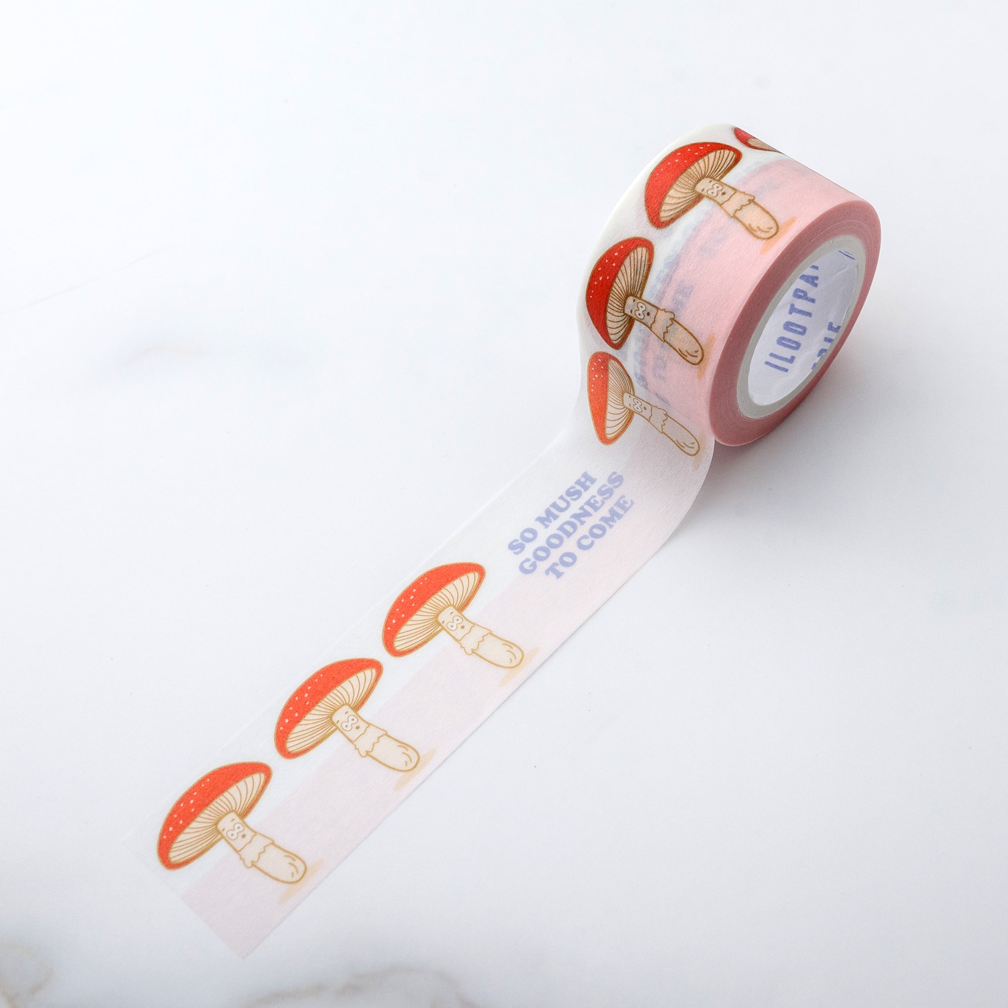 Decorative tape with white background with blue text saying, "So Mush Goodness to Come". Images of red mushrooms with gold accents.