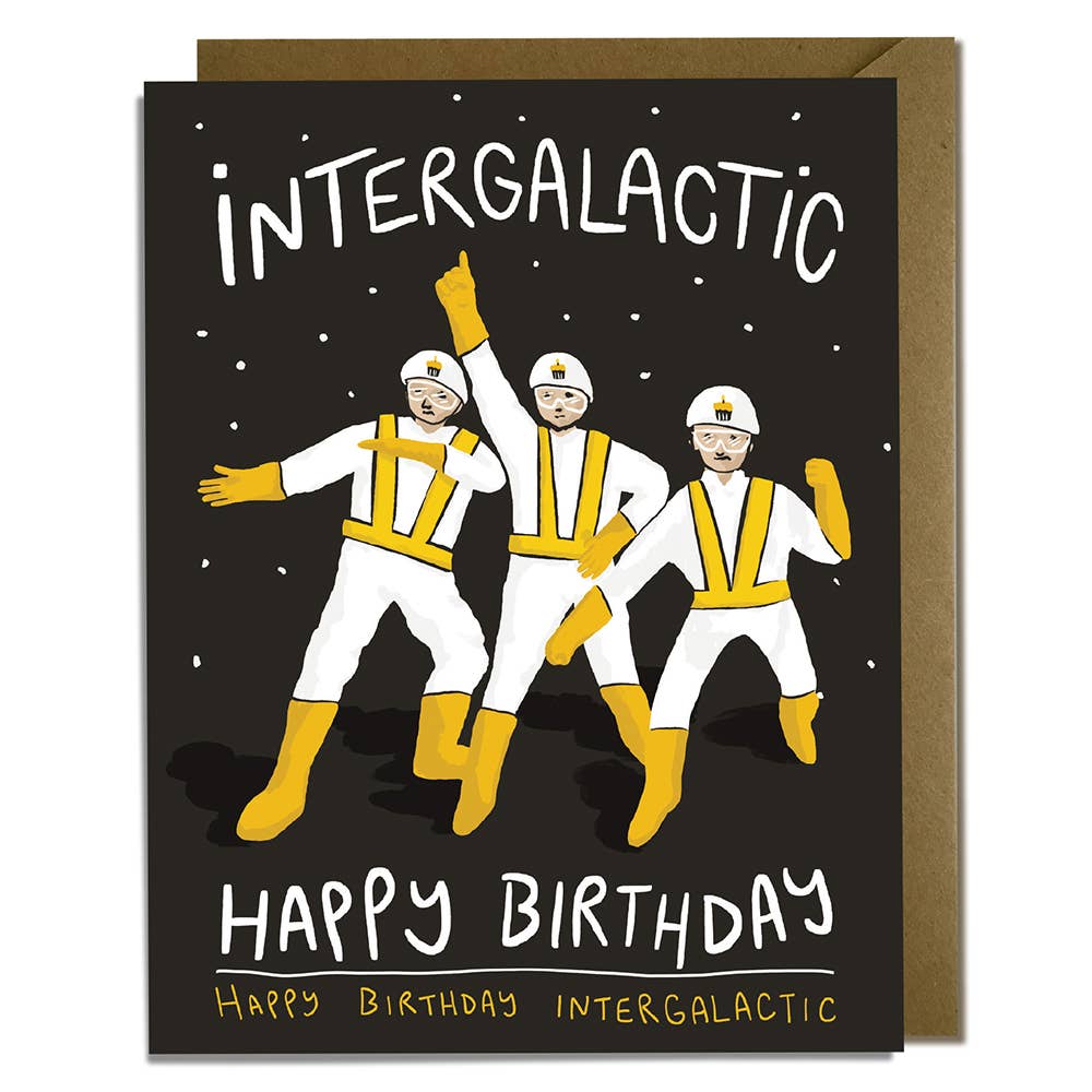 Black card with white and gold text saying, "Intergalactic Happy Birthday Happy Birthday Intergalactic". Images of three dancing astronauts with birthday cupcakes on helmets. A brown envelope is included.
