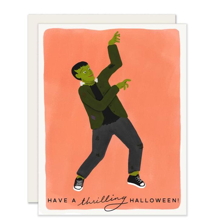 Orange card with black text saying, “Have A Thrilling Halloween”. Image of a Frankenstein monster doing the Thriller dance. A white envelope is included.